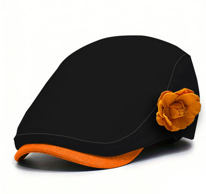 Black fabric beret with orange flower accent and orange underside brim trim.