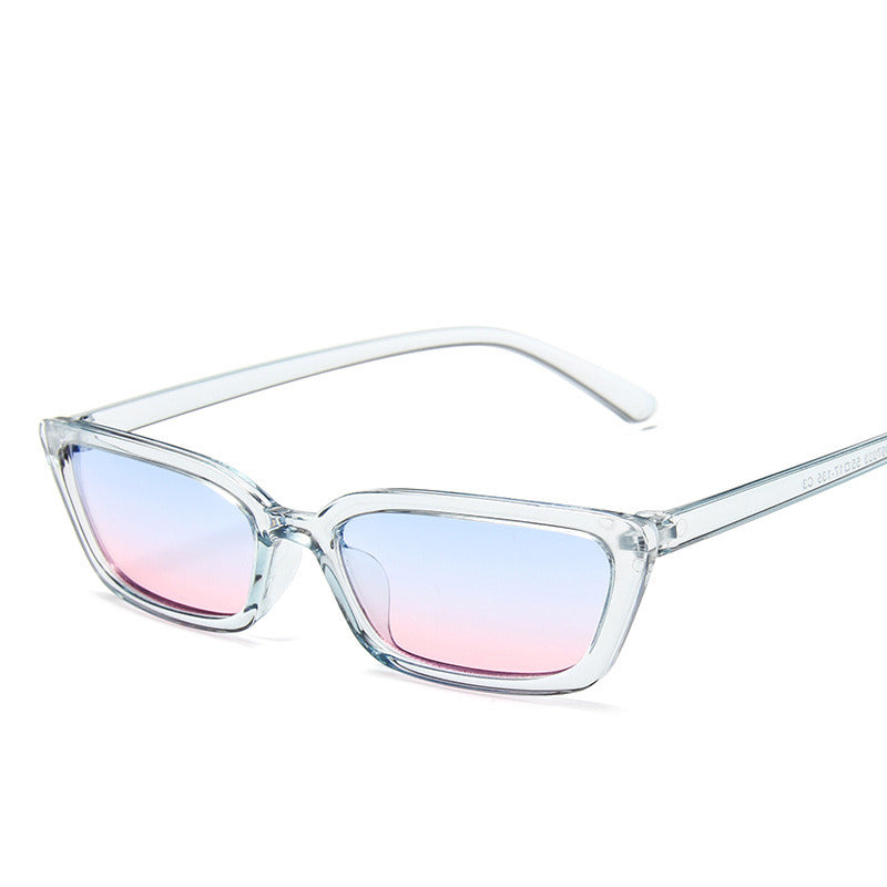 Clear frame sunglasses with gradient blue and pink lenses on a white background