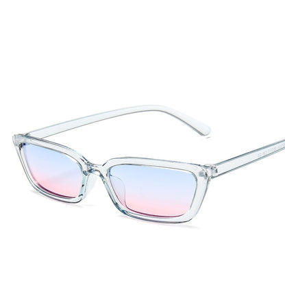 Clear frame sunglasses with gradient blue and pink lenses on a white background