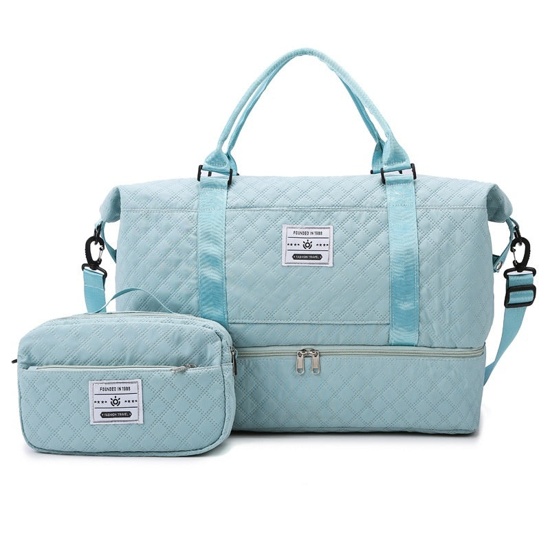 Light blue quilted travel bag with front zip and small matching crossbody pouch