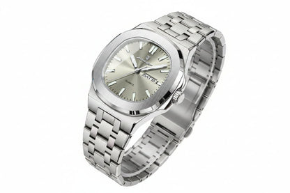 Silver watch with a metal bracelet on a beige surface, featuring a certificate of conformity.
