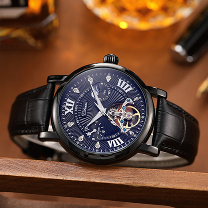 Luxury watch with a blue face and black leather strap on a wooden surface.