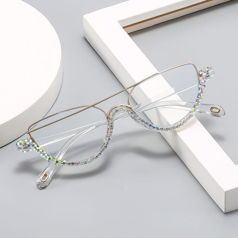 Cat-eye sunglasses with gold frame and clear lenses, jeweled multicolor rhinestone edge