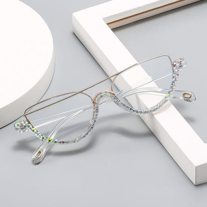 Cat-eye sunglasses with gold frame and clear lenses, jeweled multicolor rhinestone edge