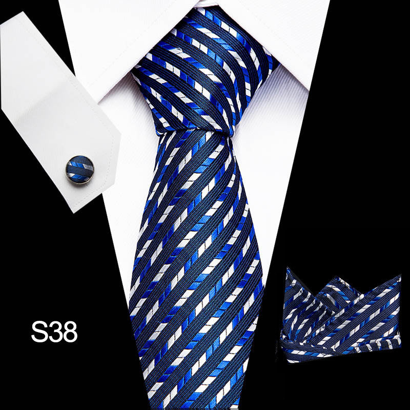 Blue and white striped tie with matching pocket square on a white shirt.