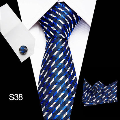 Blue and white striped tie with matching pocket square on a white shirt.
