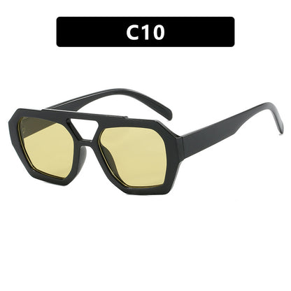 Sunglasses with black frame and yellow lenses on a white background