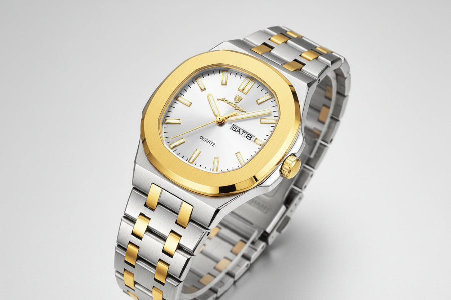 Silver and gold watch with a visible brand tag on a beige background