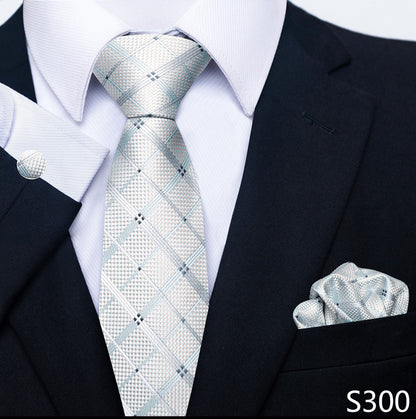 Black suit with a patterned tie and pocket square, brand 'S300' visible.