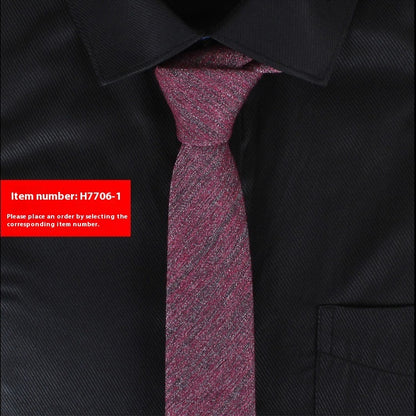Black shirt with a purple tie and a red label with item number H7706-1.