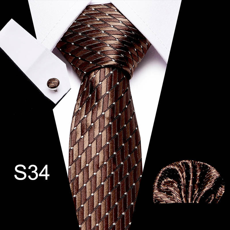 Brown patterned tie with matching pocket square on a black and white background