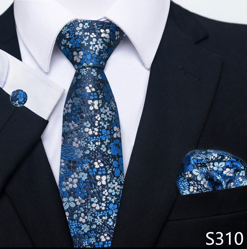 Blue floral tie and pocket square set with black suit and white shirt