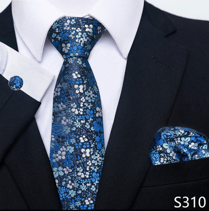 Blue floral tie and pocket square set with black suit and white shirt