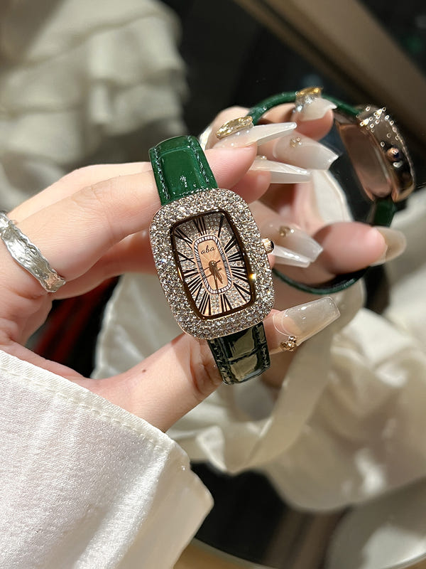 Women's diamond waterproof quartz watch with green leather-look strap and glittering bezel