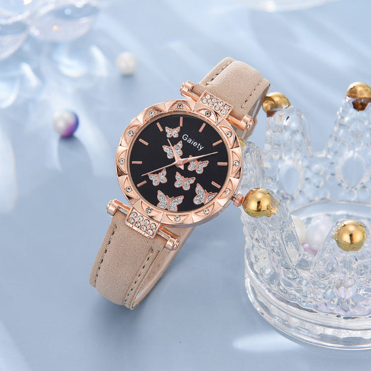 Women’s butterfly quartz watch with black dial and beige leather strap