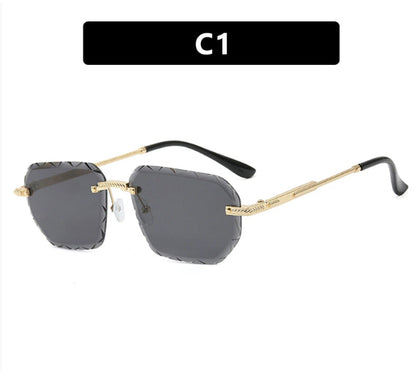 Sunglasses with gold frame and black arms on a white background