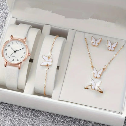 Jewelry set including a watch, bracelet, necklace, and earrings with butterfly designs in a box.
