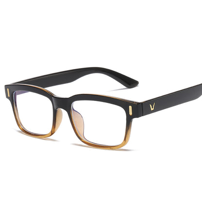 Black and gold eyeglasses on a white background