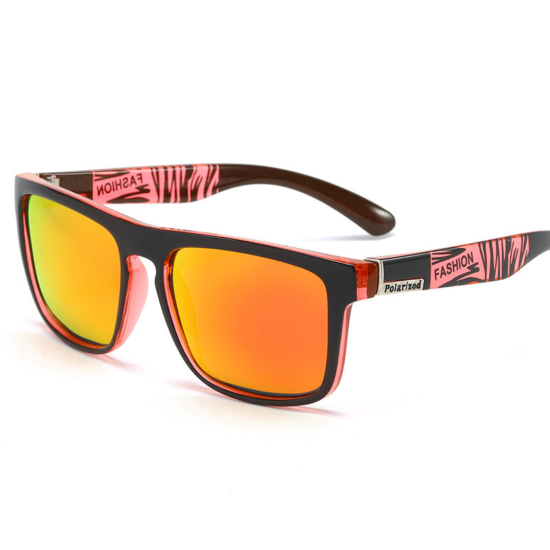 Sunglasses with pink and black frame and orange lenses on a white background