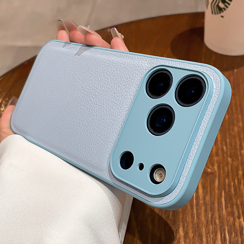 Light blue phone case with multiple camera lenses held by a person on a wooden surface.