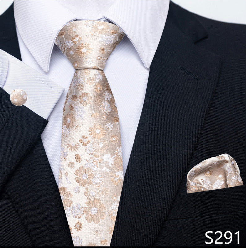 Floral tie and pocket square set with a black suit and white shirt