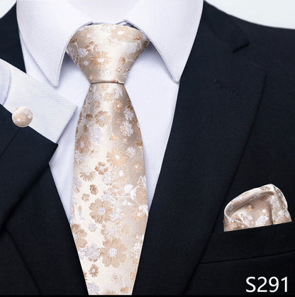 Floral tie and pocket square set with a black suit and white shirt
