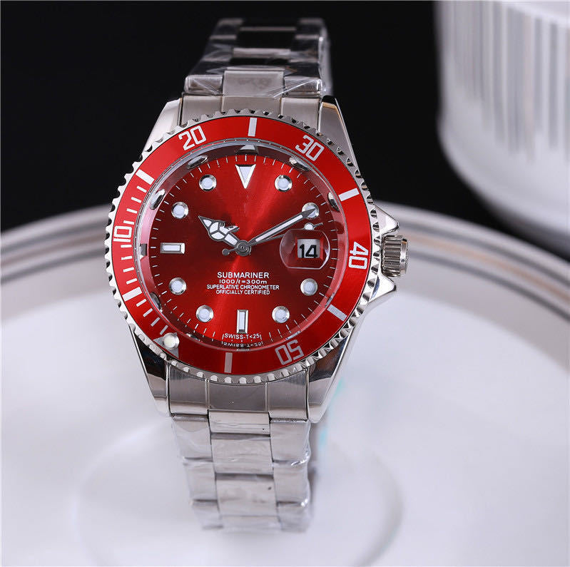 Steel wristwatch with red dial, stainless bracelet, red bezel with minute markers.