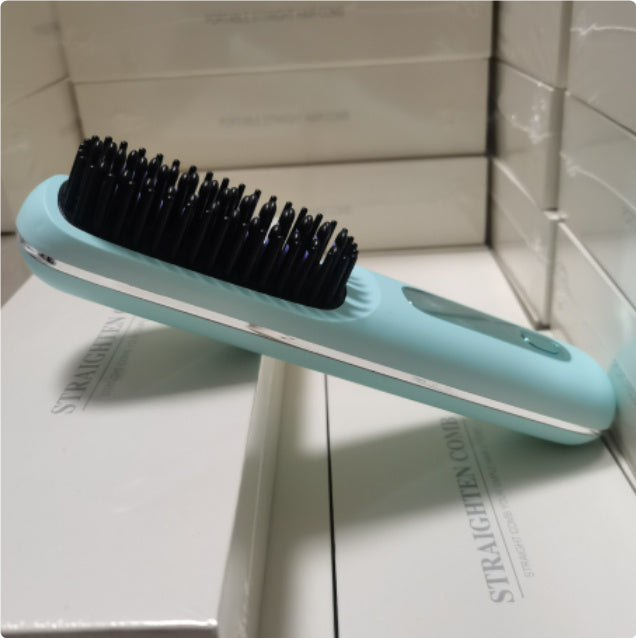 Blue hairbrush with black bristles on a white surface
