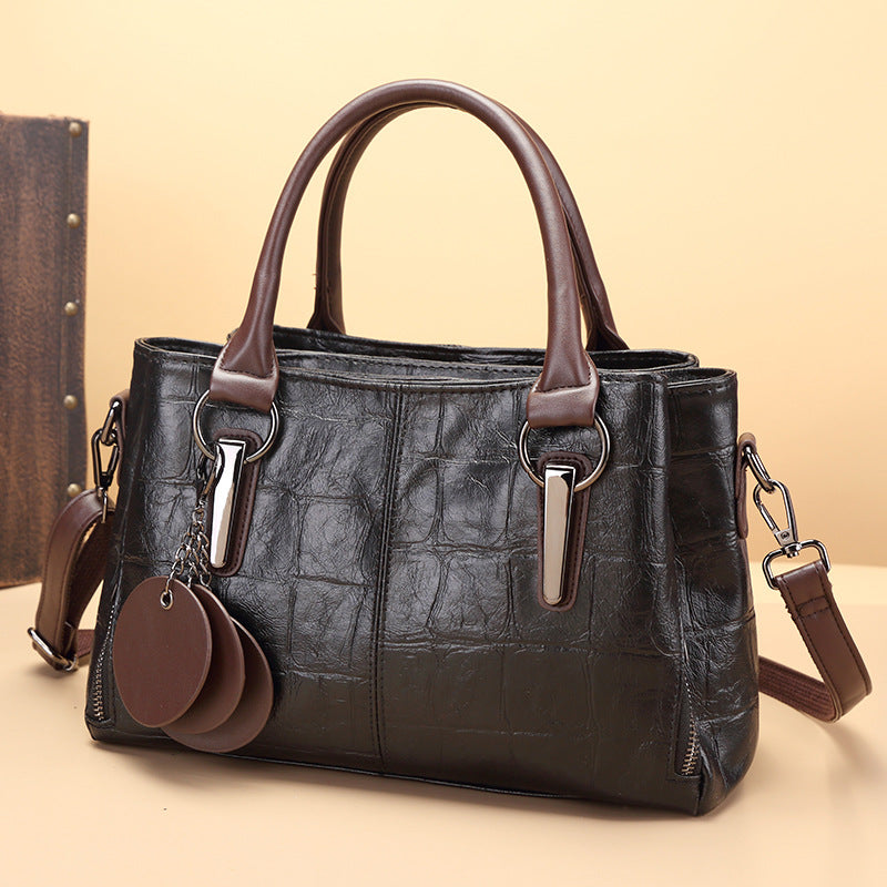Retro classic large-capacity handbag in black with two top handles and crossbody shoulder strap
