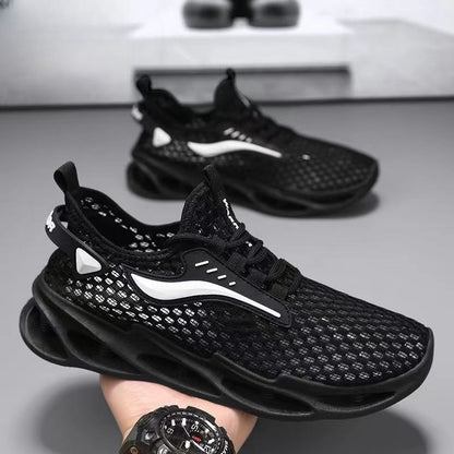 Black athletic shoes with white accents on a gray surface
