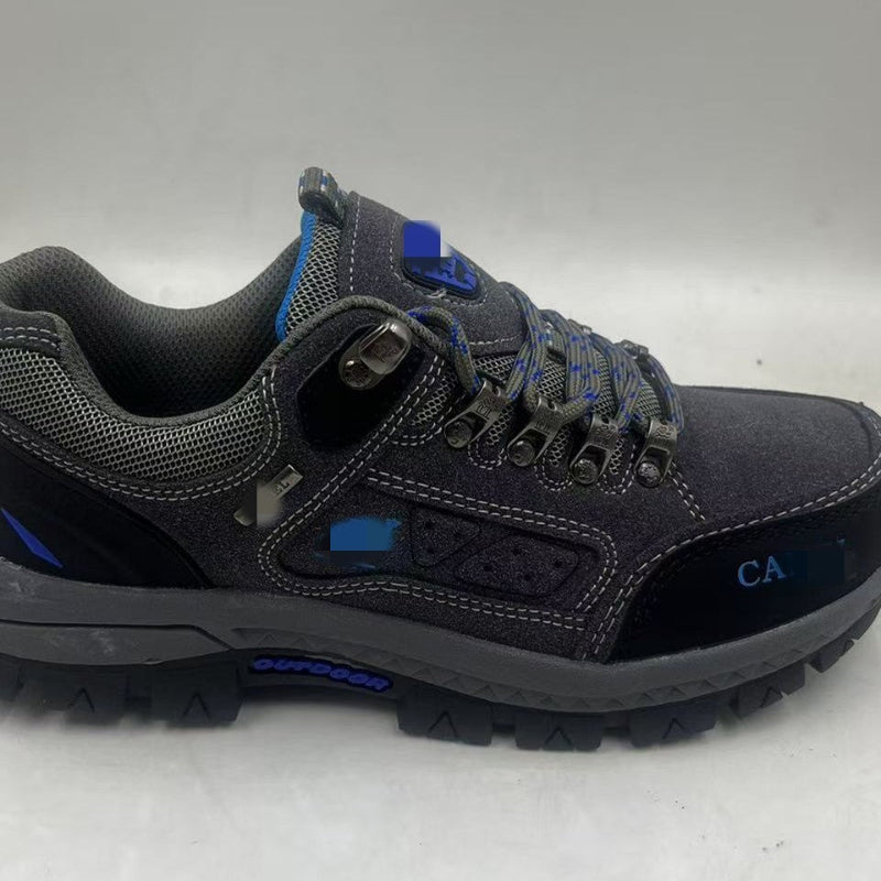Gray hiking shoe with blue accents on a white background