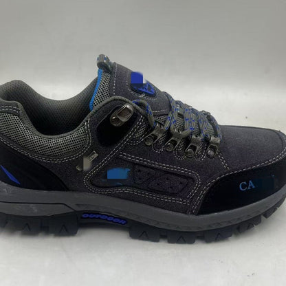 Gray hiking shoe with blue accents on a white background