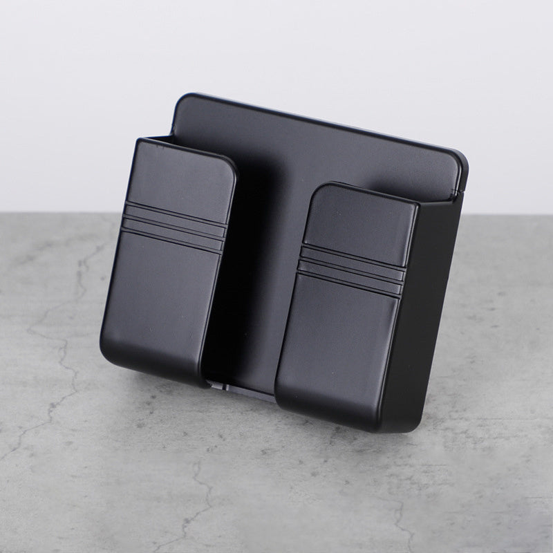 Black leather wallet on a light gray surface