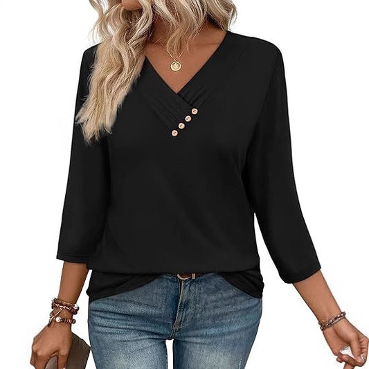 Black long-sleeve top with button details worn by a person on a white background