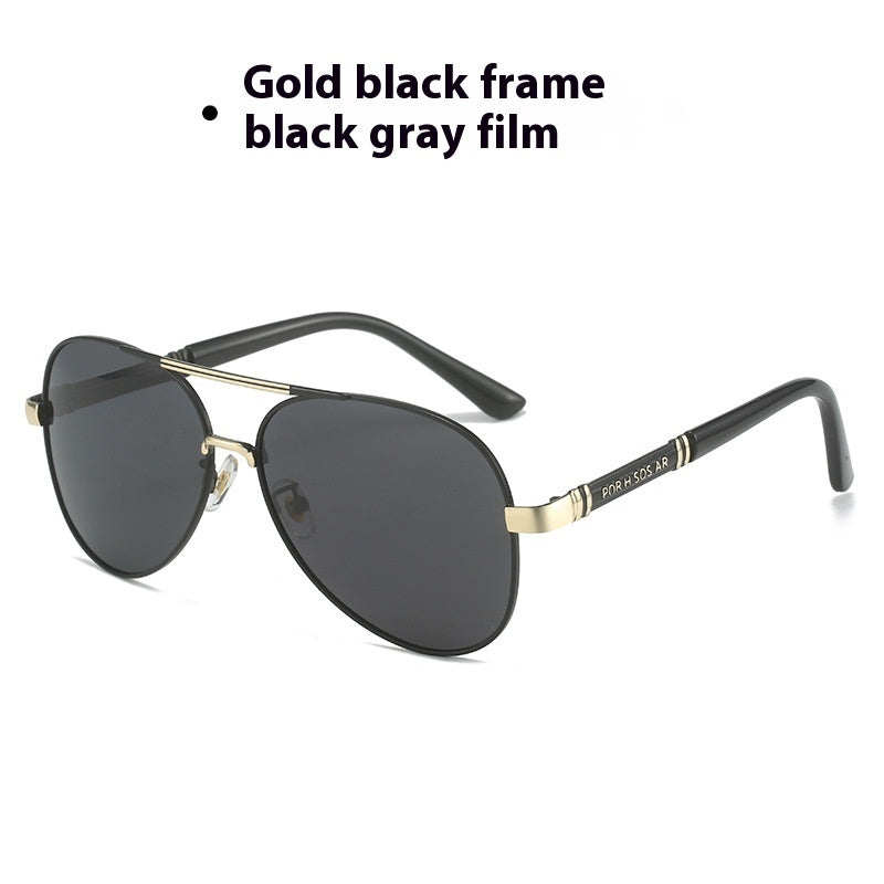 Sunglasses with gold frame and black gray lenses on a white background