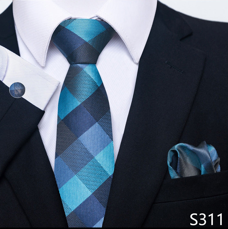Blue plaid tie and matching pocket square with a black suit and white shirt.