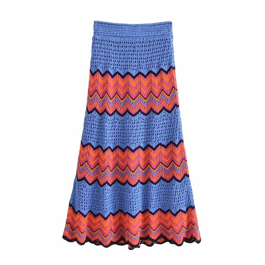 Colorful crocheted skirt with zigzag pattern on a white background