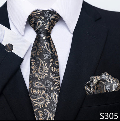 Black paisley tie and matching pocket square with a black suit and white shirt.