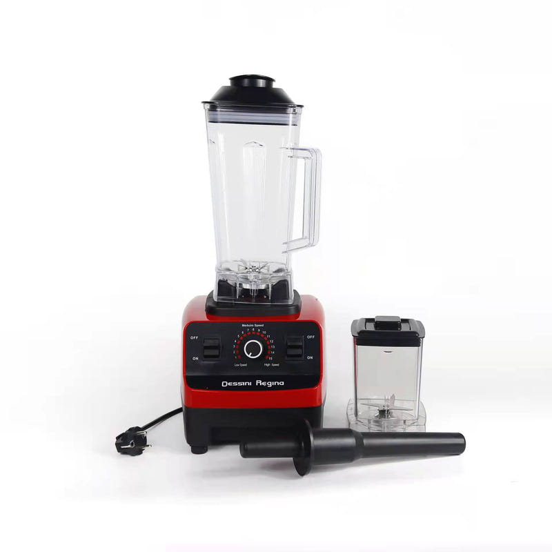 Red countertop blender with clear jug, black base, and small accessory jar