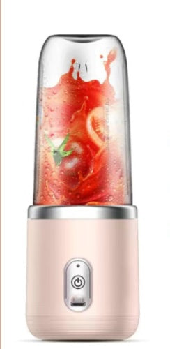 Personal blender with a pink base and clear container filled with fruit juice on a white background