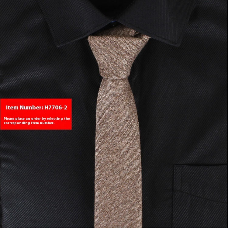 Brown tie on a black shirt with a red item number label.