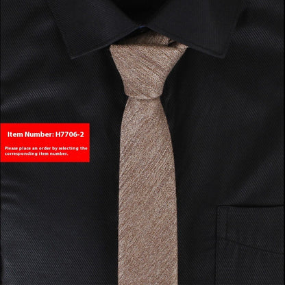 Brown tie on a black shirt with a red item number label.