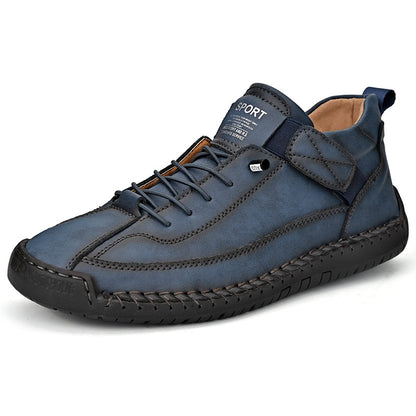 Men's mid-top leather lace-up shoe in dark blue with padded collar and textured outsole.