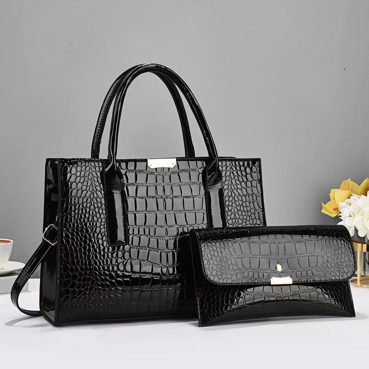 Tote and clutch bag set in black with croc-texture tote and matching clutch