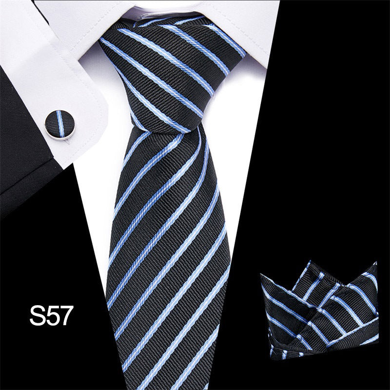 Black and blue striped tie with matching pocket square on a white shirt.