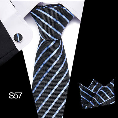 Black and blue striped tie with matching pocket square on a white shirt.