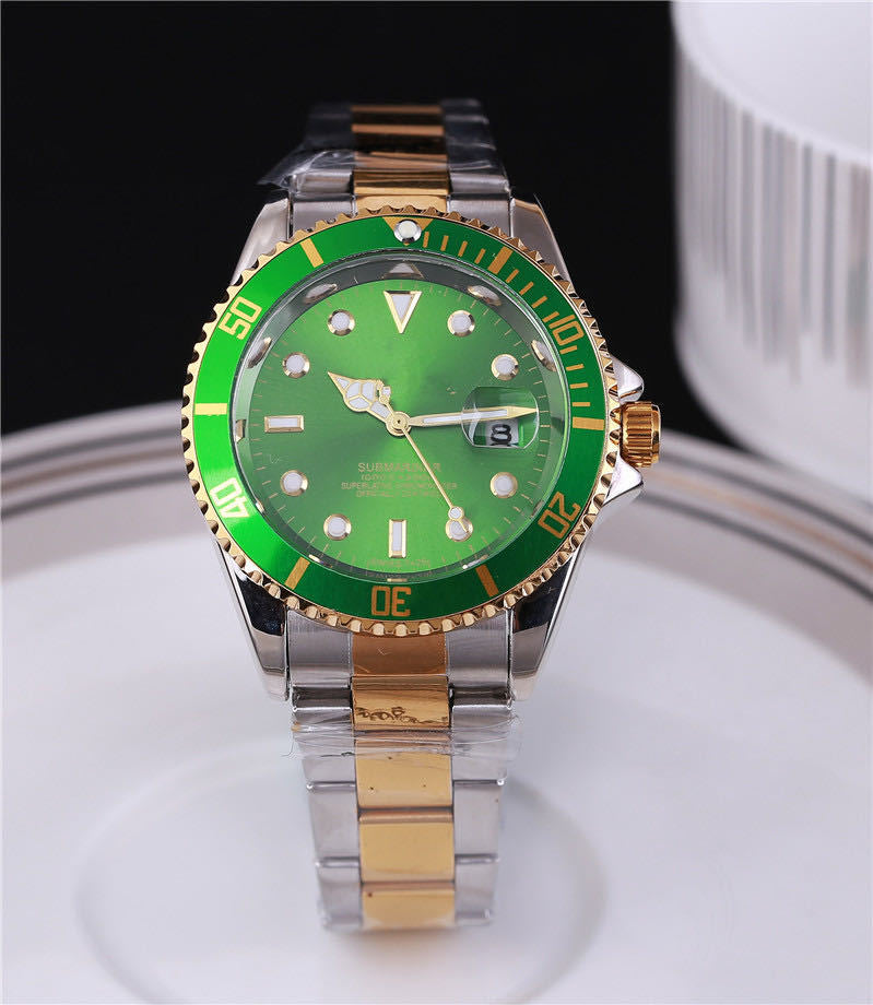Steel wristwatch with green dial, stainless bracelet, green bezel with gold accents.