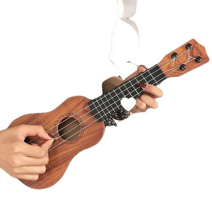 Person playing a wooden ukulele on a white background