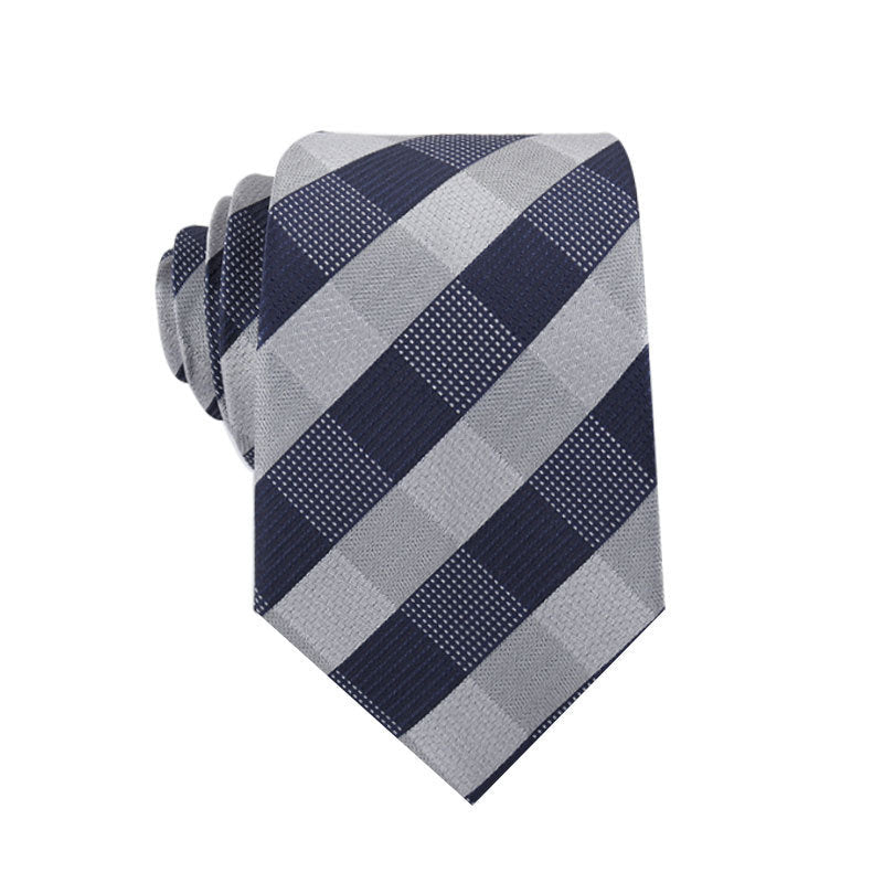 Navy and gray checkered tie on a white background