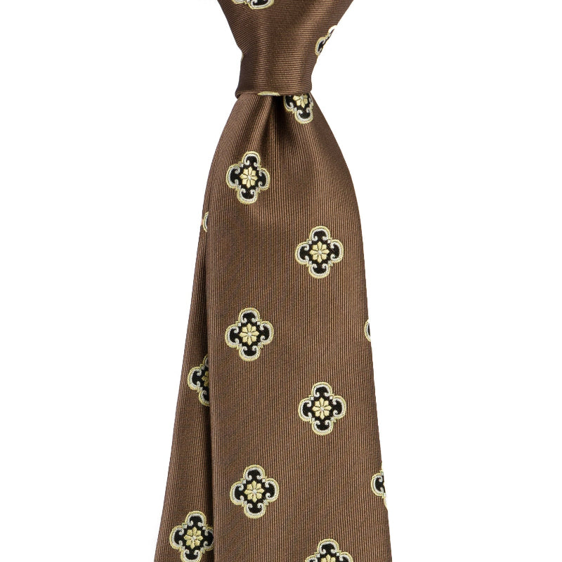 Brown tie with clover pattern on a white background